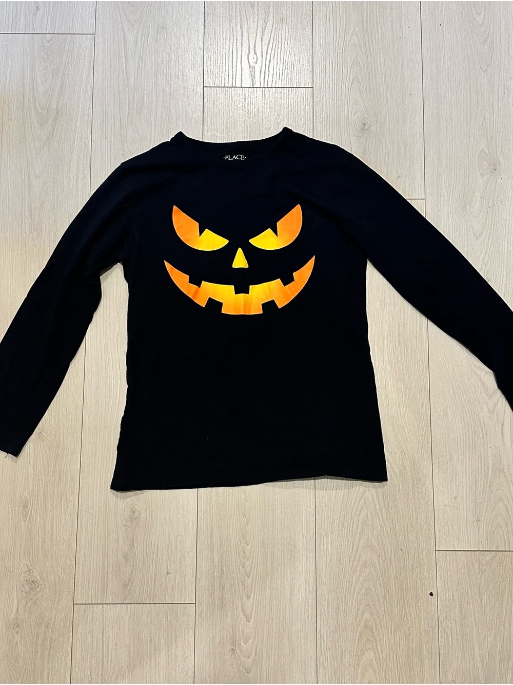 Place Black Long-Sleeve Tee with Orange Jack-O'-Lantern Face